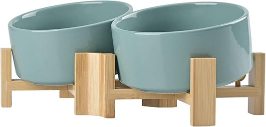 SPUNKYJUNKY 15° Slanted Ceramic Dog and Cat Bowl with Wooden Stand, Tilted Bulldog Food and Water Bowl No Slip Non-Spill for Cats Medium Dogs Big Face Pets 28.7 OZ (3.6 Cups, Light Green × 2)